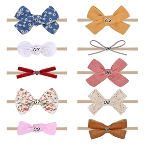 Detailed set of 10 assorted nylon baby headbands featuring diverse fabrics and floral patterns