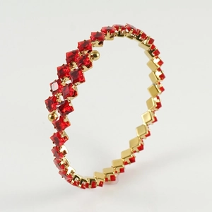 Adjustable gold plated bracelet with square red crystals in a luxury pave setting