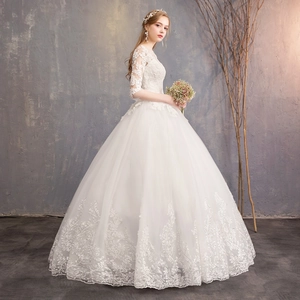 Elegant off-shoulder white lace wedding dress with medium sleeves and floral embroidery