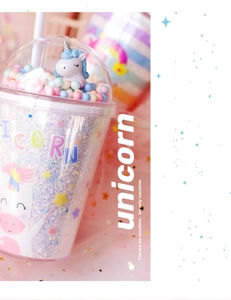 Macro view of a double-wall glitter unicorn water bottle with a 3D unicorn topper