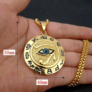 Detail view of Eye of Horus pendant with dimensions 55mm by 40mm in gold finish