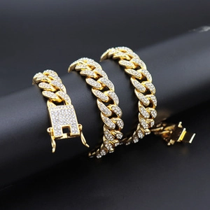 Macro shot of 20mm gold plated cuban link chain with sparkling pavé crystals