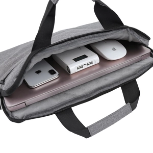 Gray fabric laptop bag with top handles and storage for mouse and accessories