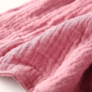 Pink double-layer cotton gauze baby comforter towel with soft wrinkled texture details