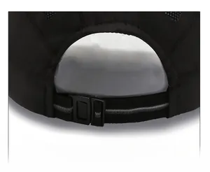 Detail of adjustable back strap with reflective strip and breathable mesh on black sports cap