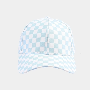 Detailed view of the light blue and white checkerboard pattern on the cotton baseball cap