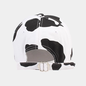 Classic cow print baseball cap with adjustable metal back buckle and curved brim