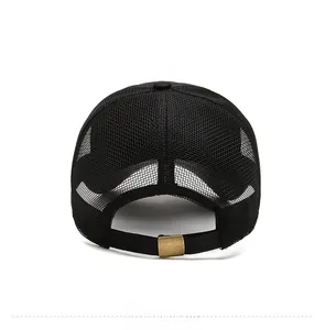 Detail view of the breathable mesh back and adjustable gold metal buckle on a black cap