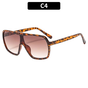 Flat top tortoiseshell sunglasses with oversized leopard print frame and brown gradient lenses