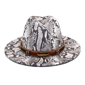Detail of snake skin pattern fedora with brown braided band and gold feather charm