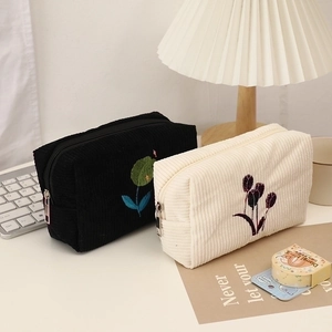 Corduroy floral cosmetic bag with tulip embroidery in black and cream white colors