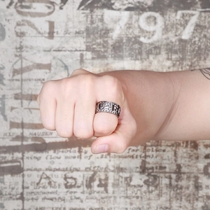 Macro shot of retro car tire pattern and hammered texture on men titanium steel ring