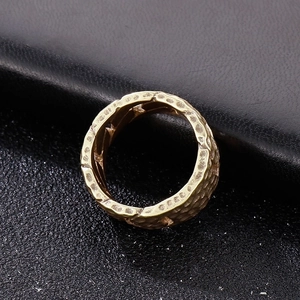 Vintage gold hammer-textured titanium steel ring with rugged lava finish for men
