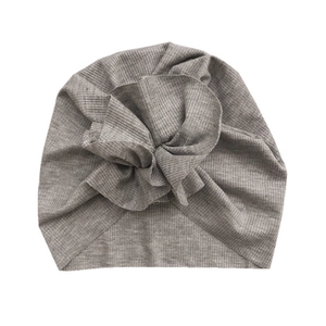 Gray ribbed knit turban hat for kids with stylish knot detail on white background