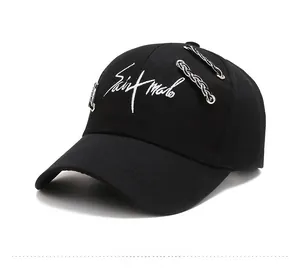 Close-up of black baseball cap with Saint Malo embroidery and silver chain detail