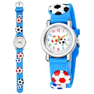 Detail of blue silicone strap with 3D embossed football patterns on children's watch