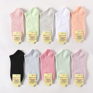 Set of 10 solid color cotton low-cut ankle socks in a colorful variety with brand tags