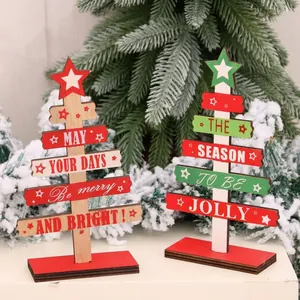 Detail view of wooden DIY Christmas trees with festive Merry and Bright typography