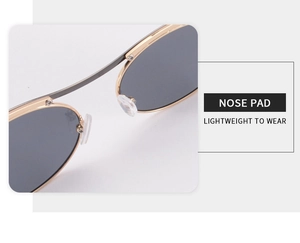 Detail of soft nose pads and gold metal frame on lightweight sunglasses