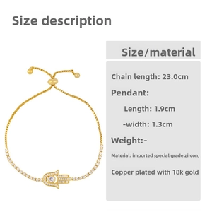 Detail of 18K gold-plated Hamsa Hand bracelet with adjustable slider and zircons