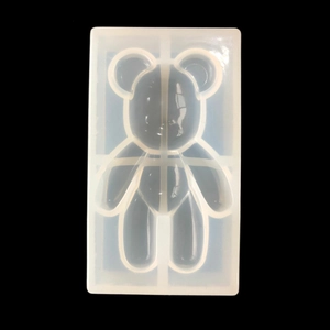 DIY silicone bear mold for resin casting and handmade home ornaments on black background