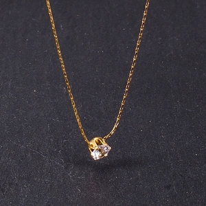 Detail of 18K gold-plated titanium necklace with sparkling cubic zirconia pendant