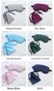 Detail of silk satin sleep mask sets in six colors with matching drawstring storage bags
