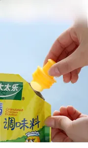 Detail showing the installation of a plastic sealing nozzle on a food spice seasoning bag