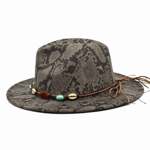 Close-up of snakeskin fedora hat with turquoise beads and shell woven band detail