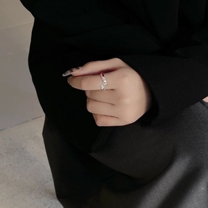 Minimalist S925 sterling silver open ring on model finger with sleek polished finish