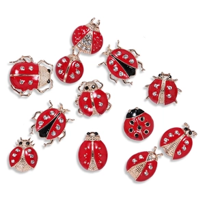 Creative ladybug brooch set with red enamel and sparkling crystal rhinestones on white background