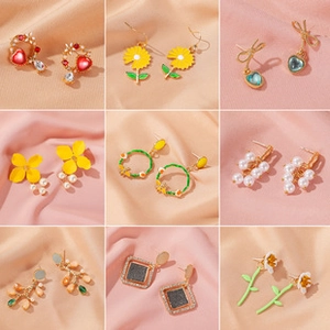 Detailed grid of gold stud earrings with floral patterns and pearl embellishments