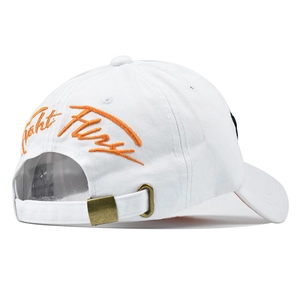 Close-up of white baseball cap back with orange embroidery and vintage metal buckle
