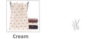 Close-up of soft thick cotton towel with red heart jacquard pattern hanging on a basket