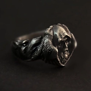 Vintage oxidized silver ring featuring a detailed Nordic Odin and raven relief design