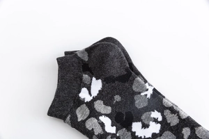 Close-up of gray camouflage pattern on mid-calf sweat-absorbent cotton casual socks