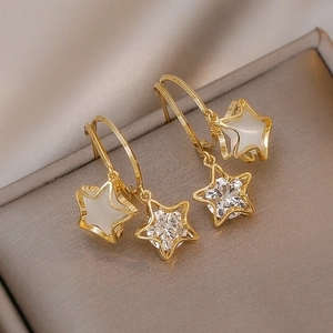 Minimalist gold star stud earrings with white cat-eye stone and sparkling cubic zirconia