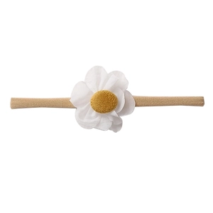 Detailed view of elastic khaki baby headband featuring white 3D flower with yellow stamen