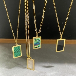 Four gold-plated stainless steel rectangle pendants with colorful shell inlays