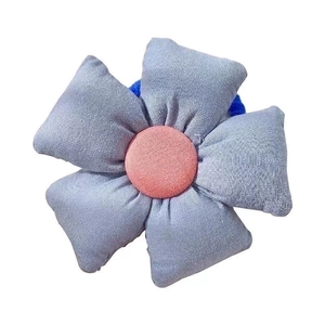 Cute sunflower hair tie for girls featuring blue fabric petals and a pink center core