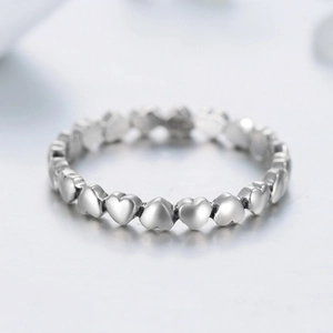 Minimalist S925 sterling silver ring featuring linked heart shapes on white background