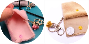 Close-up of plush mini coin purses with metal lobster clasps and tassel charms