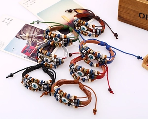 Detail of adjustable evil eye beaded leather bracelets in various vibrant colors