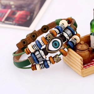 Vintage multilayer leather bracelet with evil eye charm, wooden beads, and adjustable cord