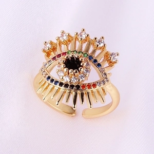 Adjustable golden evil eye ring featuring colorful cubic zirconia stones and eyelashes