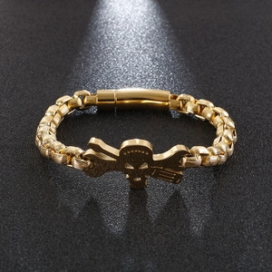 Men's gold-tone stainless steel punk bracelet with skull and cross wrenches on black texture