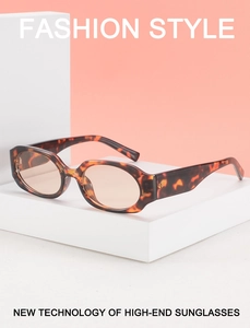 Detail of vintage tortoise sunglasses with tinted lenses on geometric display