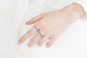 Detailed view of S925 sterling silver double-finger ring with micro-pave moissanite stones