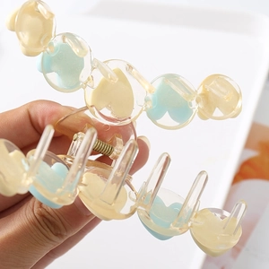 Matte heart-shaped hair claw clip in cream and blue tones for women's hairstyles