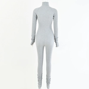 Rear view of a grey long sleeve jumpsuit featuring high neck and pleated leg details